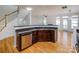 Kitchen island with granite countertop, sink, and dishwasher at 2151 Belle Vernon Ave, Charlotte, NC 28210