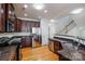 Modern kitchen, stainless steel appliances, granite countertops, and hardwood floors at 2151 Belle Vernon Ave, Charlotte, NC 28210