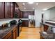 Bright kitchen featuring stainless steel appliances, granite countertops, and wooden cabinets at 2151 Belle Vernon Ave, Charlotte, NC 28210