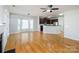 Bright living room with hardwood floors, fireplace, and access to kitchen at 2151 Belle Vernon Ave, Charlotte, NC 28210