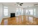 Living room with hardwood floors, fireplace, and abundant natural light at 2151 Belle Vernon Ave, Charlotte, NC 28210