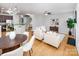 Open concept living room and staircase with hardwood floors and lots of natural light at 2151 Belle Vernon Ave, Charlotte, NC 28210