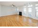 Open living room with hardwood floors and fireplace at 2151 Belle Vernon Ave, Charlotte, NC 28210