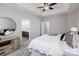 Spacious main bedroom featuring a tray ceiling, carpet, and access to a bathroom at 2151 Belle Vernon Ave, Charlotte, NC 28210