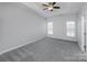 Main bedroom with ceiling fan and grey carpet at 2151 Belle Vernon Ave, Charlotte, NC 28210