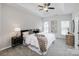 Spacious main bedroom featuring tray ceiling, carpet, and a ceiling fan at 2151 Belle Vernon Ave, Charlotte, NC 28210