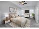 Main bedroom with carpet, ceiling fan, and staged furniture at 2151 Belle Vernon Ave, Charlotte, NC 28210