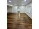 Expansive basement area with neutral walls, recessed lighting, and attractive vinyl floors at 217 Ruby Ln, Gastonia, NC 28054