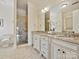 Luxurious Primary bathroom with granite countertops and a double vanity at 2823 Providence Rd # 252, Charlotte, NC 28211