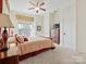 Charming bedroom with a queen-size bed and a ceiling fan at 2823 Providence Rd # 252, Charlotte, NC 28211