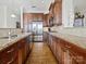 Kitchen boasts granite countertops and rich wood cabinetry at 2823 Providence Rd # 252, Charlotte, NC 28211