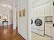 Convenient laundry room with washer, dryer, and storage cabinets at 2823 Providence Rd # 252, Charlotte, NC 28211