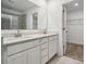 Double vanity bathroom with white cabinets and a walk-in closet at 307 Bezelle Ave, York, SC 29745