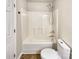 Bathroom featuring a shower/tub combo and updated toilet at 3164 River Rd, Lincolnton, NC 28092