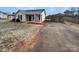 House exterior showcasing a carport and stone details at 3164 River Rd, Lincolnton, NC 28092