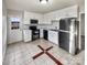 Clean kitchen with stainless steel appliances and tiled floor at 3164 River Rd, Lincolnton, NC 28092