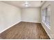 Simple living room with neutral walls and wood-look floors at 3164 River Rd, Lincolnton, NC 28092