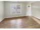 Bright living room with neutral walls and wood-look flooring at 3164 River Rd, Lincolnton, NC 28092