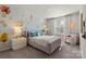 Charming bedroom with floral wall mural, comfortable bed, and cozy armchair at 319 Bezelle Ave, York, SC 29745