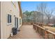 Spacious back deck for outdoor entertaining overlooks the private backyard and mature trees at 33287 Mann Rd, Albemarle, NC 28001