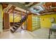 Unfinished basement featuring exposed ceiling, shelving and stairs at 33287 Mann Rd, Albemarle, NC 28001