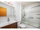 Bathroom featuring glass enclosed shower and updated vanity with integrated sink and modern fixtures at 33287 Mann Rd, Albemarle, NC 28001