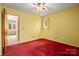 Bedroom featuring neutral walls, a window and an open doorway at 33287 Mann Rd, Albemarle, NC 28001