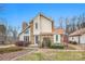 Charming home exterior featuring stone accents and manicured landscaping, creating a warm and inviting curb appeal at 33287 Mann Rd, Albemarle, NC 28001