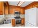 Efficient kitchen showcasing wood cabinetry, stainless steel appliances and ample counter space at 33287 Mann Rd, Albemarle, NC 28001