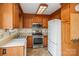 Well-equipped kitchen with stainless steel appliances, light wood cabinets, and a functional layout at 33287 Mann Rd, Albemarle, NC 28001