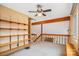 Loft space featuring built-in shelves, neutral carpet, and a view into the living room below at 33287 Mann Rd, Albemarle, NC 28001