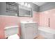 Bathroom with pink tile, vanity, and bathtub at 3515 Back Creek Church Rd, Charlotte, NC 28213