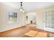 Bright dining room with hardwood floors and view to living room and kitchen at 3515 Back Creek Church Rd, Charlotte, NC 28213