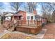 Brick ranch house with wooden deck and steps at 3515 Back Creek Church Rd, Charlotte, NC 28213