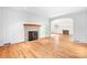 Living room with hardwood floors, fireplace and access to another living area at 3515 Back Creek Church Rd, Charlotte, NC 28213