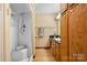 Bathroom with a shower, vanity, and wood cabinets at 3910 6Th Nw St, Hickory, NC 28601