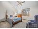 Bright bedroom with a comfortable bed, ample closet space, and a ceiling fan at 3910 6Th Nw St, Hickory, NC 28601