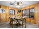 Cozy dining room with wood paneling, round table, and lake view at 3910 6Th Nw St, Hickory, NC 28601