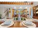 Bright dining room with wood table, kitchen view, and natural light at 3910 6Th Nw St, Hickory, NC 28601