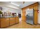 Kitchen features stainless steel refrigerator and ample wood cabinetry at 3910 6Th Nw St, Hickory, NC 28601