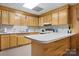 Galley kitchen with light wood cabinets and ample counter space at 3910 6Th Nw St, Hickory, NC 28601