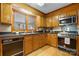 Galley kitchen with wood cabinets and modern appliances at 3910 6Th Nw St, Hickory, NC 28601