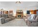 Living room with a brick fireplace and two brown leather recliners at 3910 6Th Nw St, Hickory, NC 28601