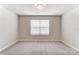 Bright bedroom with neutral walls and carpet at 4000 Cheyney Park Dr, Charlotte, NC 28269