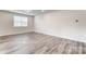 Large bedroom with hardwood floors and a window at 4000 Cheyney Park Dr, Charlotte, NC 28269