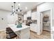 Modern kitchen with white cabinets, quartz countertops, and island at 4004 Cheyney Park Dr, Charlotte, NC 28269