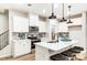 Modern kitchen with white cabinets, quartz countertops, and an island at 4004 Cheyney Park Dr, Charlotte, NC 28269