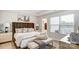 Bright main bedroom with plush bedding and private access to balcony at 4004 Cheyney Park Dr, Charlotte, NC 28269