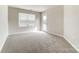 Bright bedroom with carpeted floor and door to balcony at 4016 Cheyney Park Dr, Charlotte, NC 28269