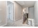 Upper level hallway with carpeted floors and staircase access at 4016 Cheyney Park Dr, Charlotte, NC 28269